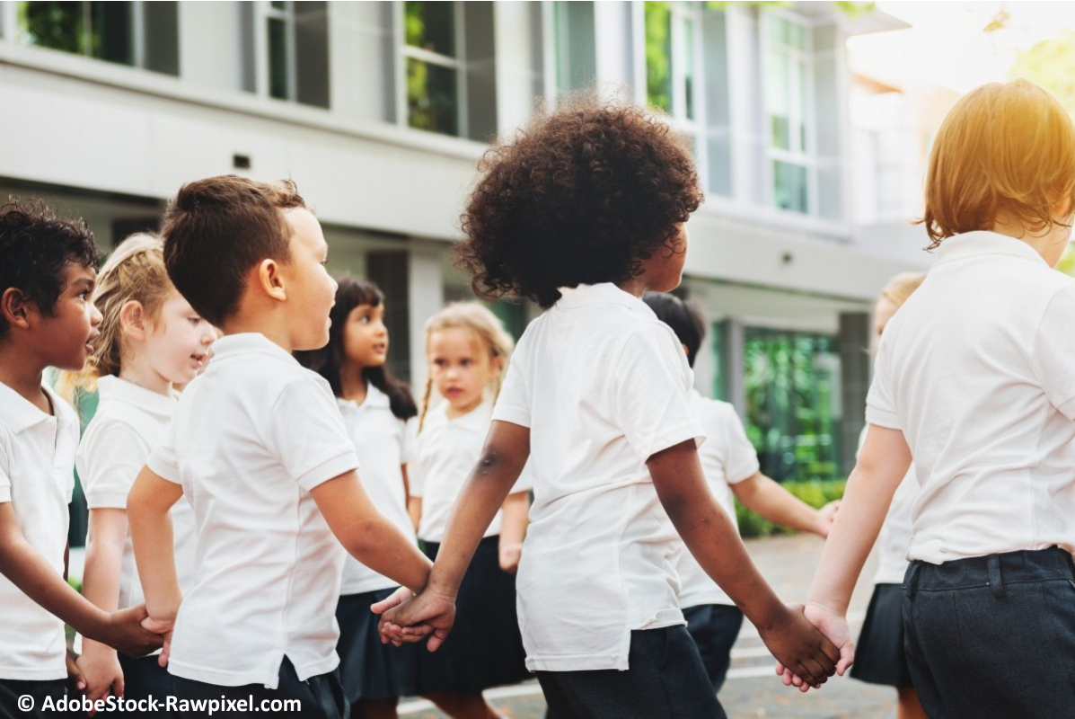 A group of children playing a game in the school yard.
